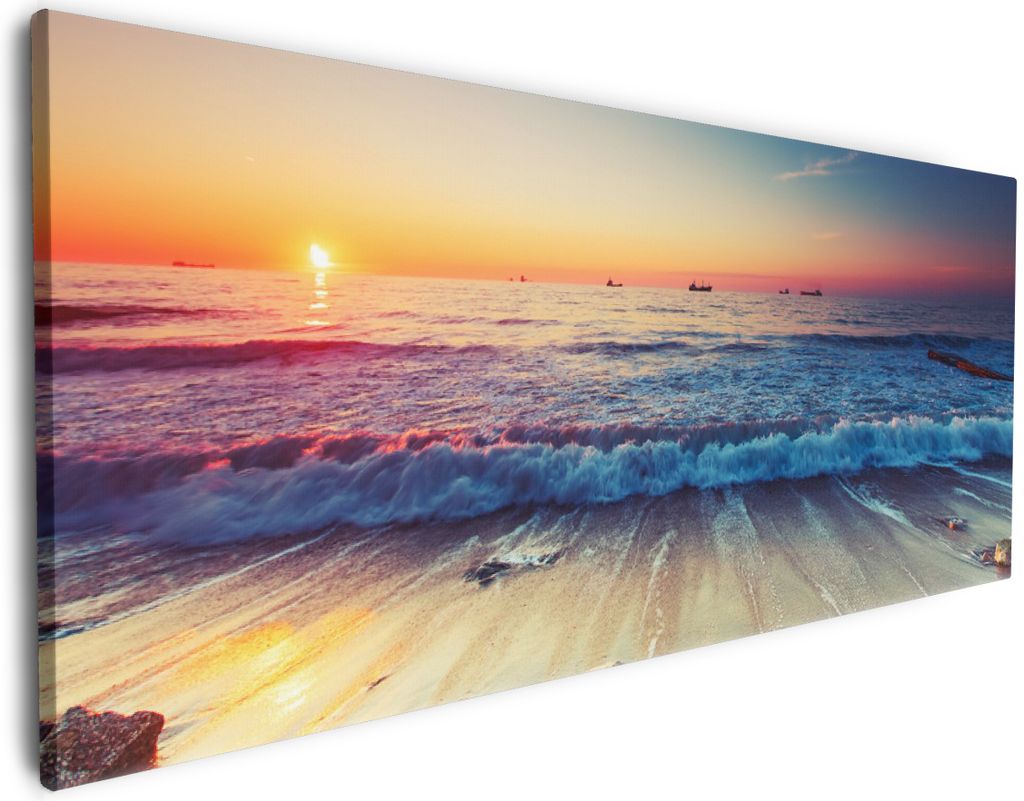 Wallario Premium Leinwandbild Sonnenuntergang am Meer mit Wellen am Strand in Größe 80 x 200 cm