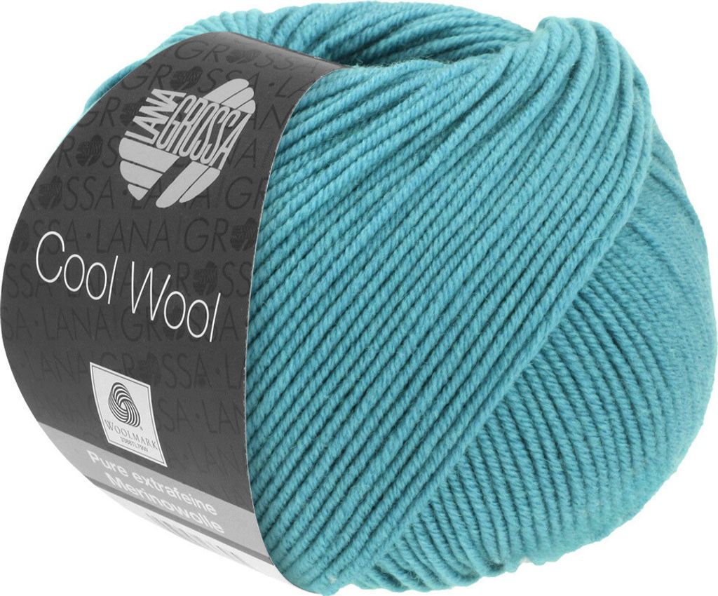 A ball of teal yarn with a label.
