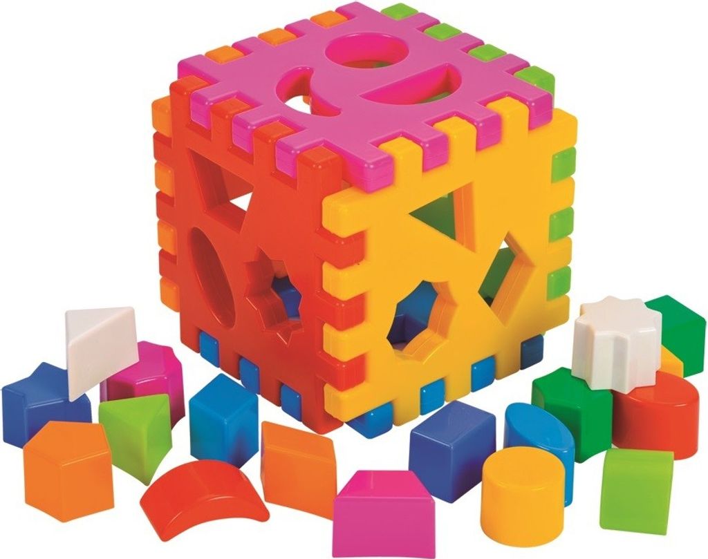 A colorful shape-sorting cube toy with various geometric shapes scattered around it.