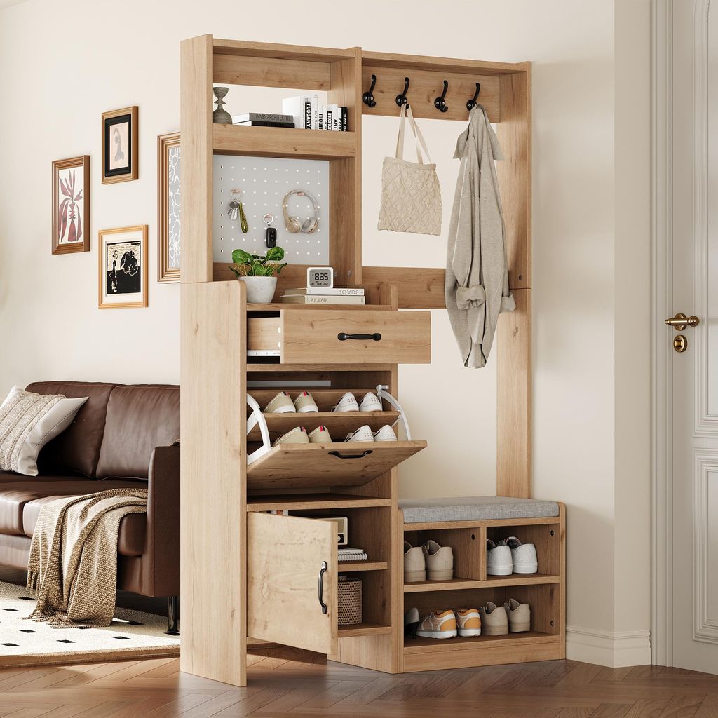A hallway or entryway with a furniture set for storing shoes and coats, next to a sofa.