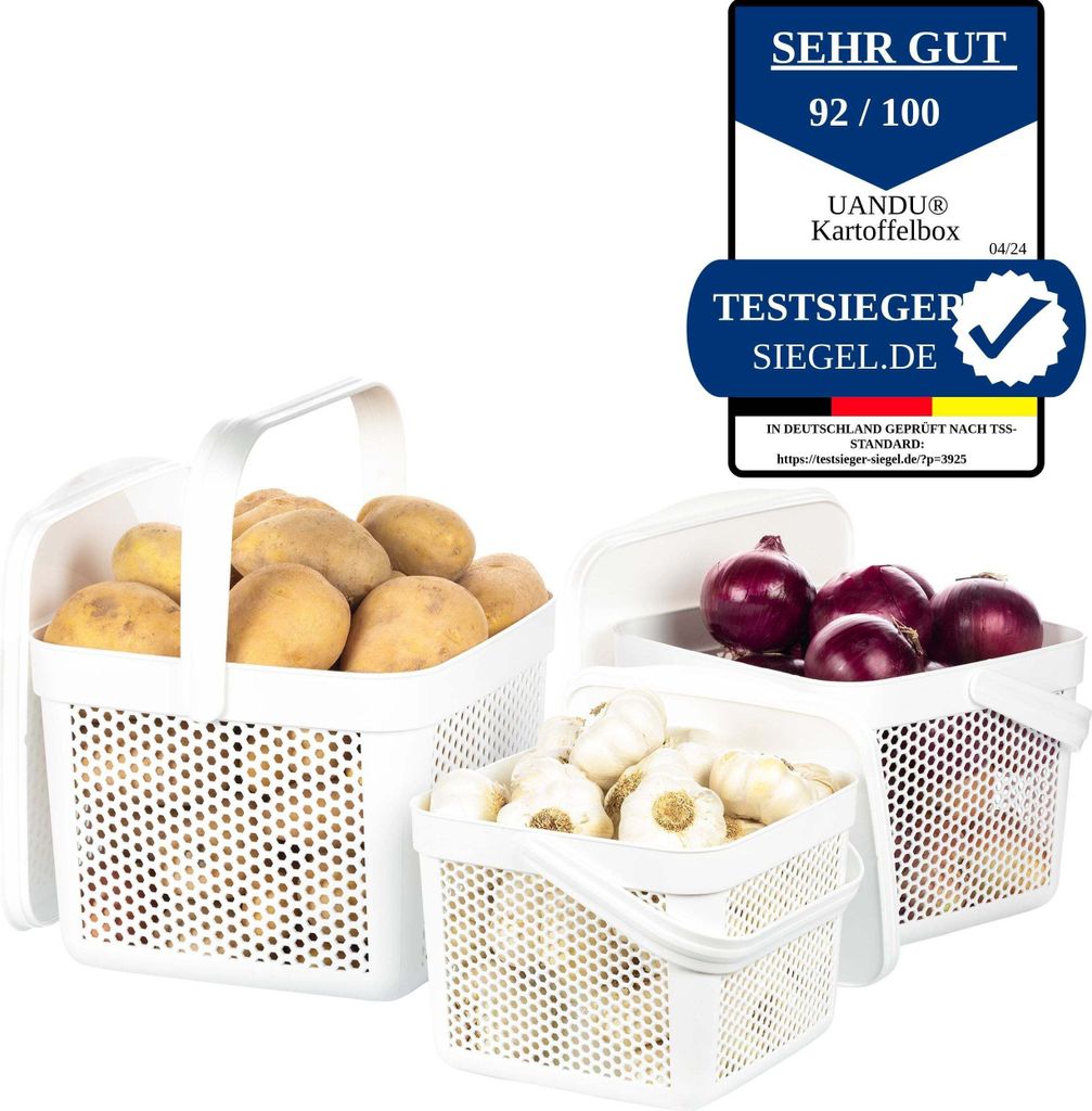 Three white storage baskets filled with potatoes, garlic, and onions, with a German product review badge in the upper right corner.