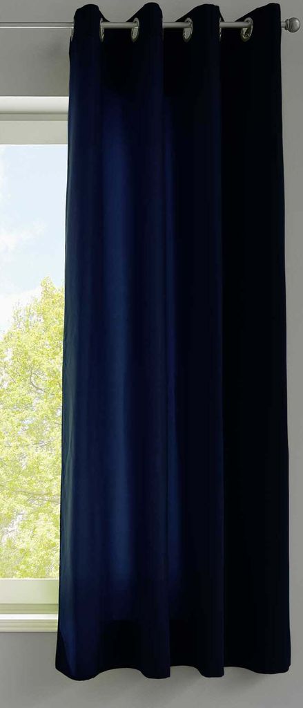 A dark blue curtain hanging in front of a window.