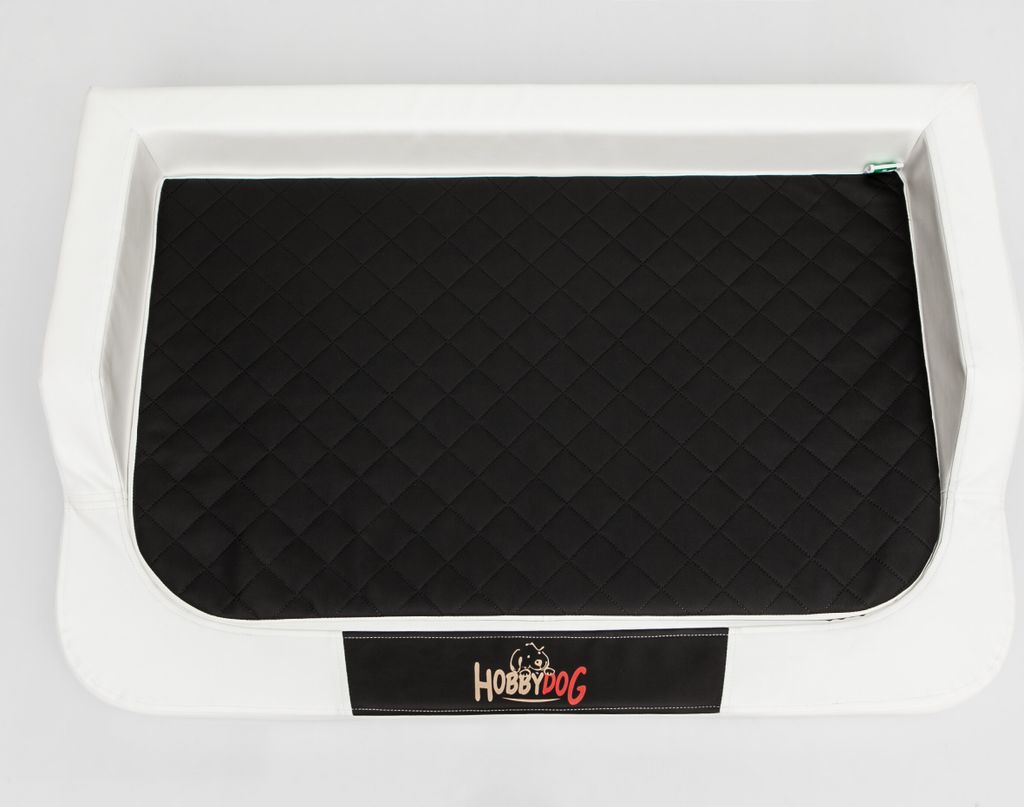 A dog bed with a black quilted cushion inside a white frame, placed on a white background.