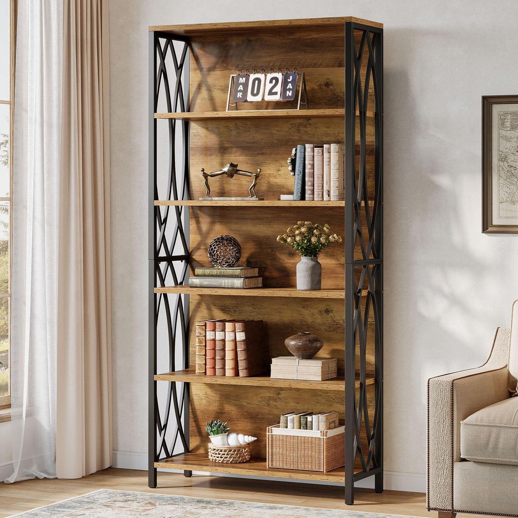 A tall, industrial-style bookshelf filled with books and decorative items, placed in a living room setting next to a window with curtains and a sofa.