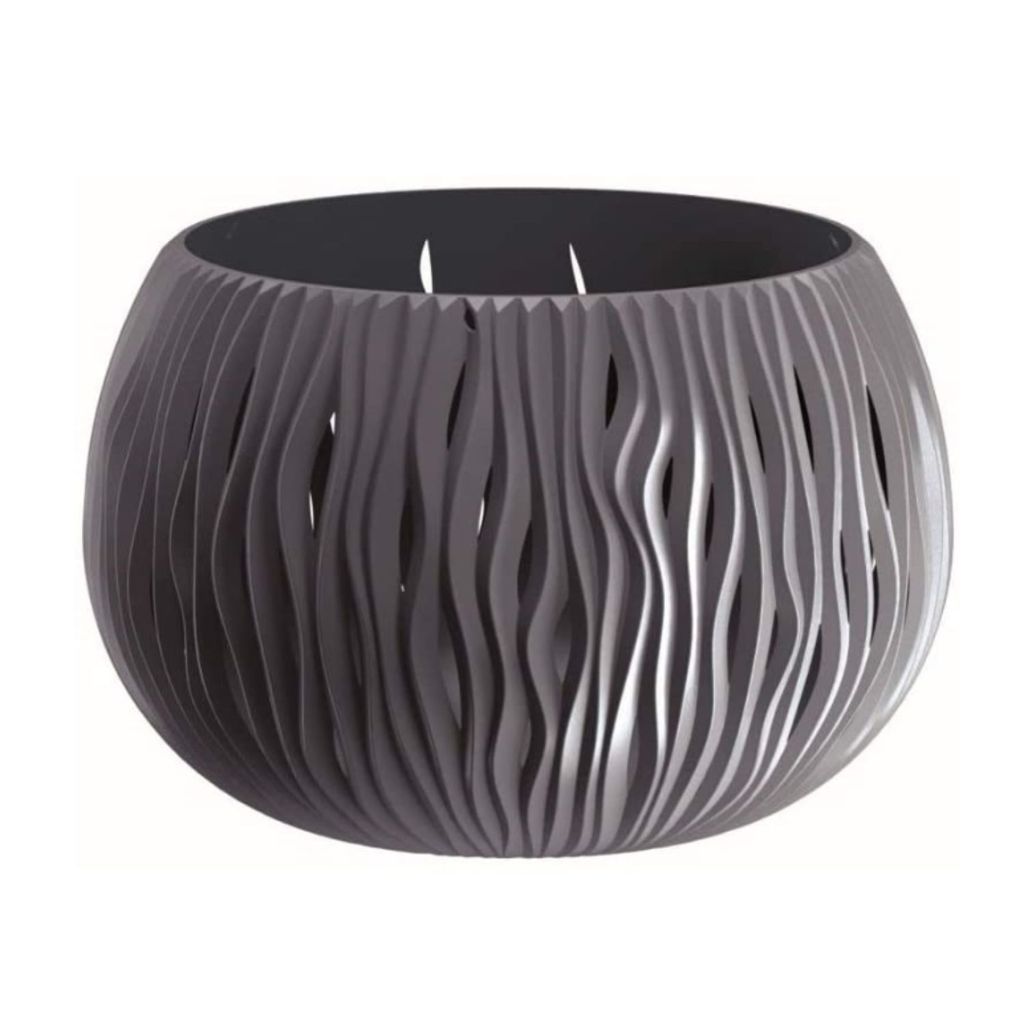 A gray, round planter with a wavy, cut-out design sits on a white background.