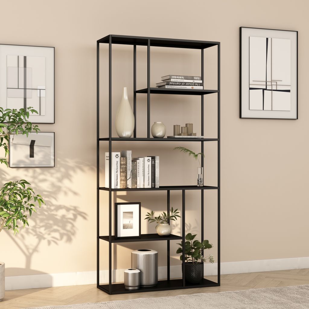 A black metal bookshelf filled with books, vases, and plants, placed against a light beige wall.