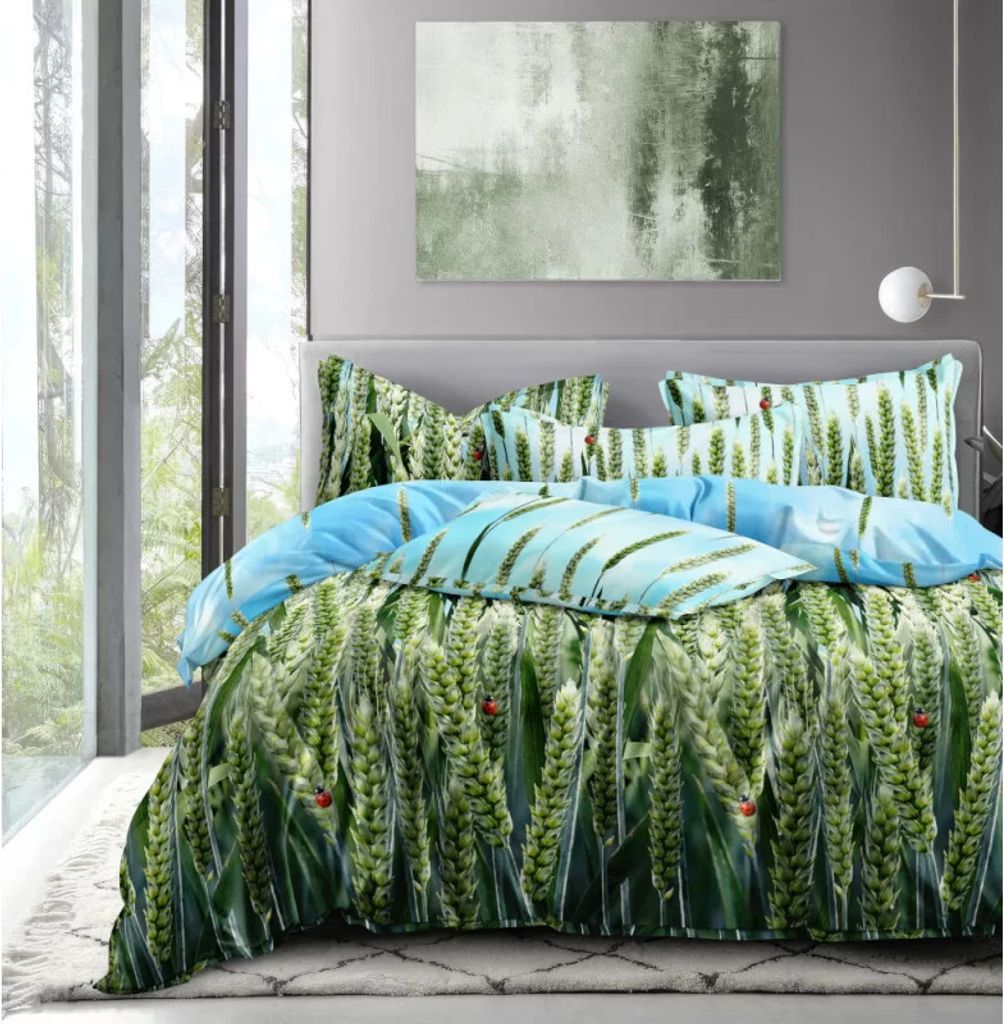 A bed with a green and blue patterned duvet cover and pillows, set in a room with a large window and abstract art on the wall.