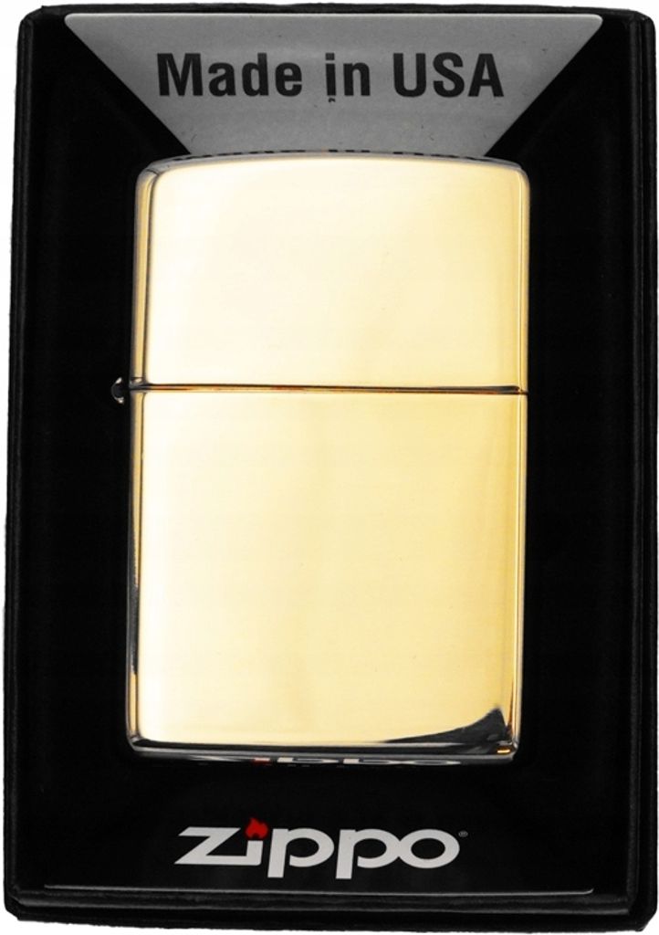 A gold Zippo lighter is displayed in its black packaging.