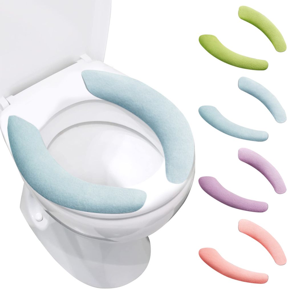 A toilet seat with light blue covers and several colorful toilet seat covers displayed next to it.