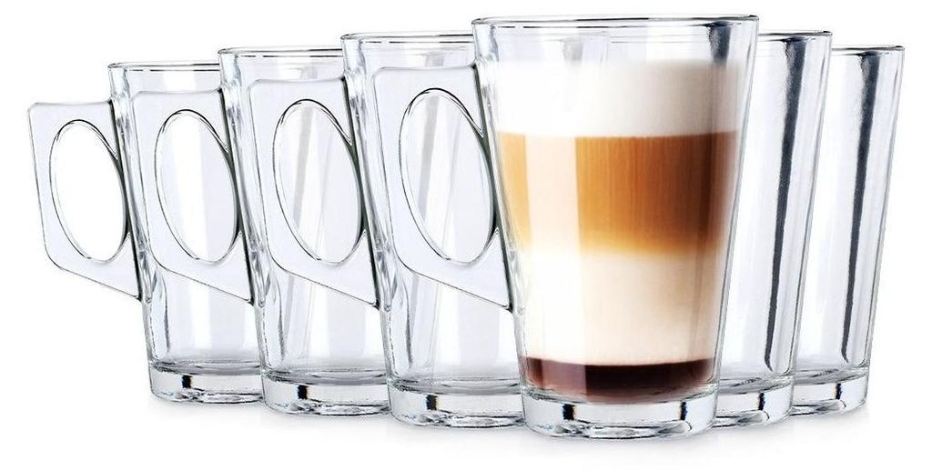 A set of six clear glass tumblers with handles, one of which is filled with a layered coffee drink.