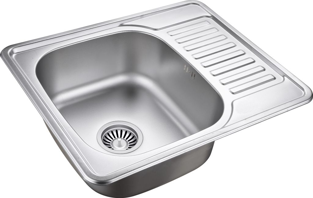 A stainless steel kitchen sink with a drainboard.