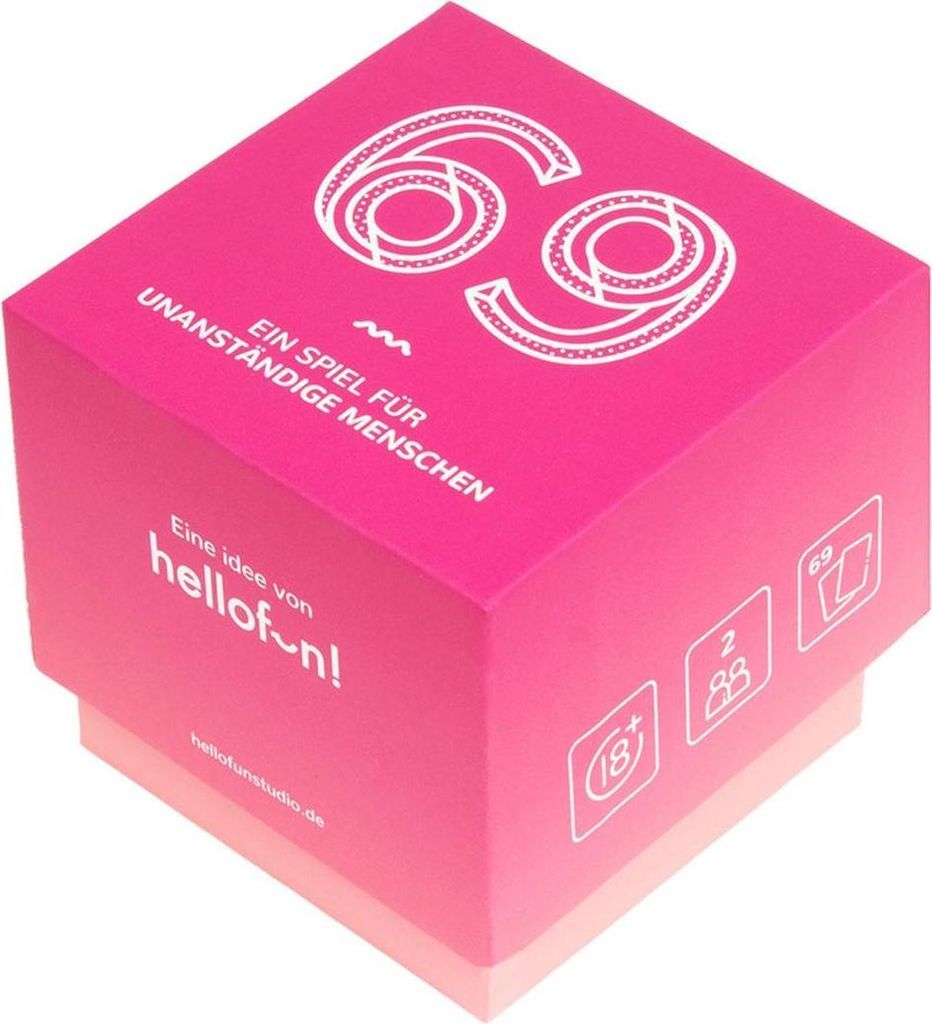 A pink cube-shaped box with white text and graphics, likely packaging for a game or product.