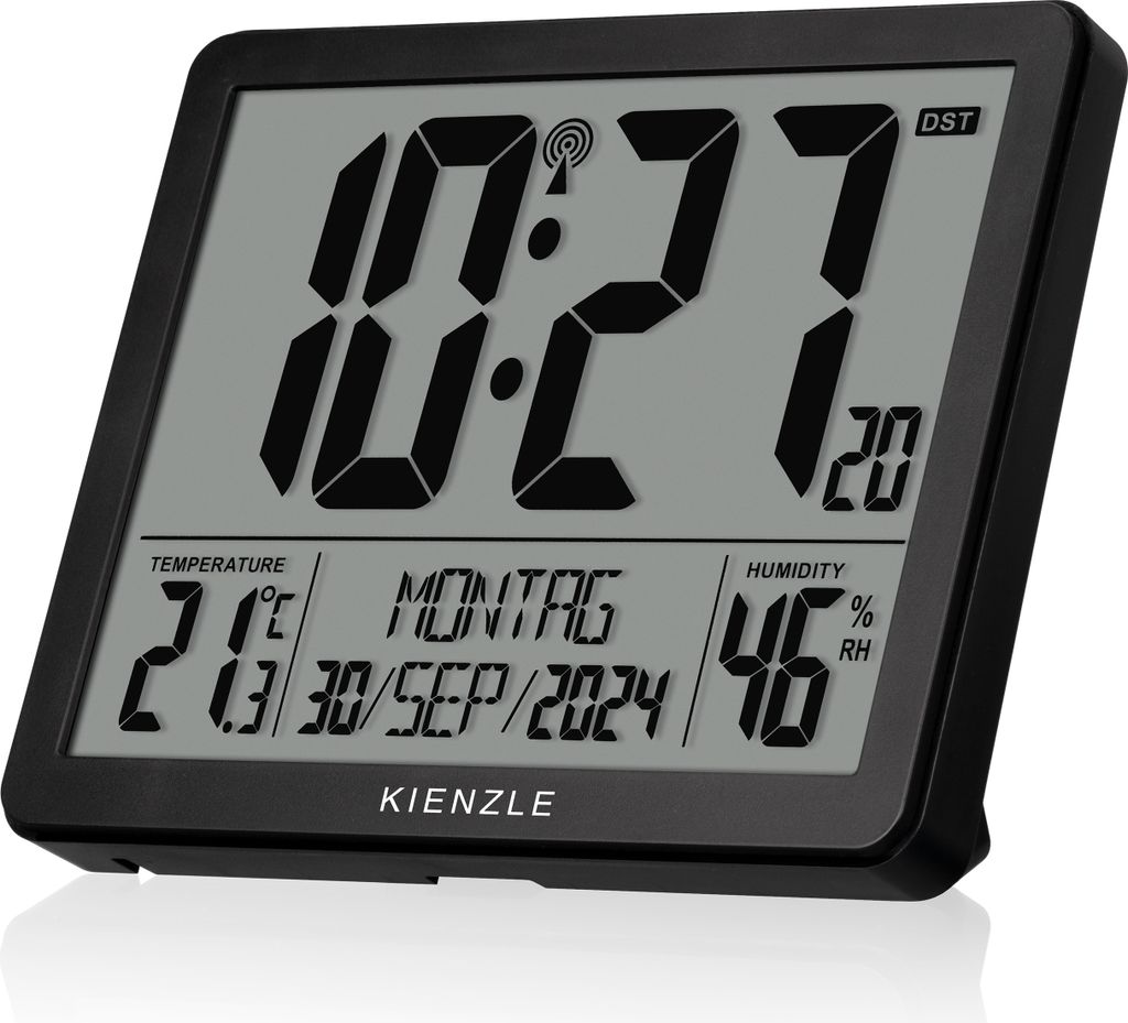 A digital clock displaying time, date, temperature, and humidity.