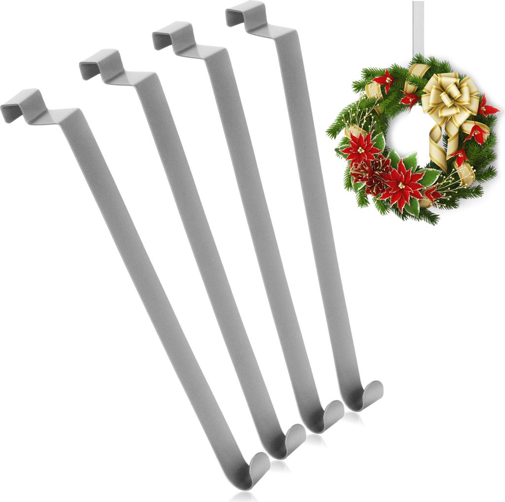 Four gray metal door hooks are shown diagonally on a white background, with a Christmas wreath hanging in the upper right corner.