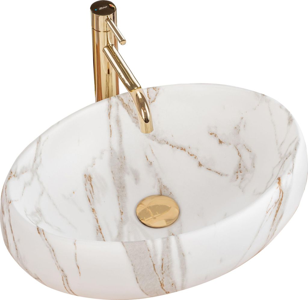 A white oval sink with gold veining and a gold faucet.