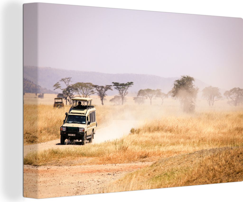 OneMillionCanvasses - Leinwandbilder - 140x90 cm, Ein Safariauto fährt über das trockene Grasland in Afrika, Wandbilder Kunstdruck Wanddekoration