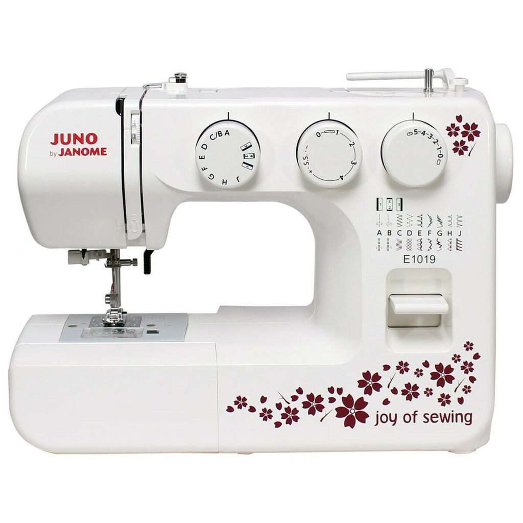 A white sewing machine with decorative maroon floral patterns and text.