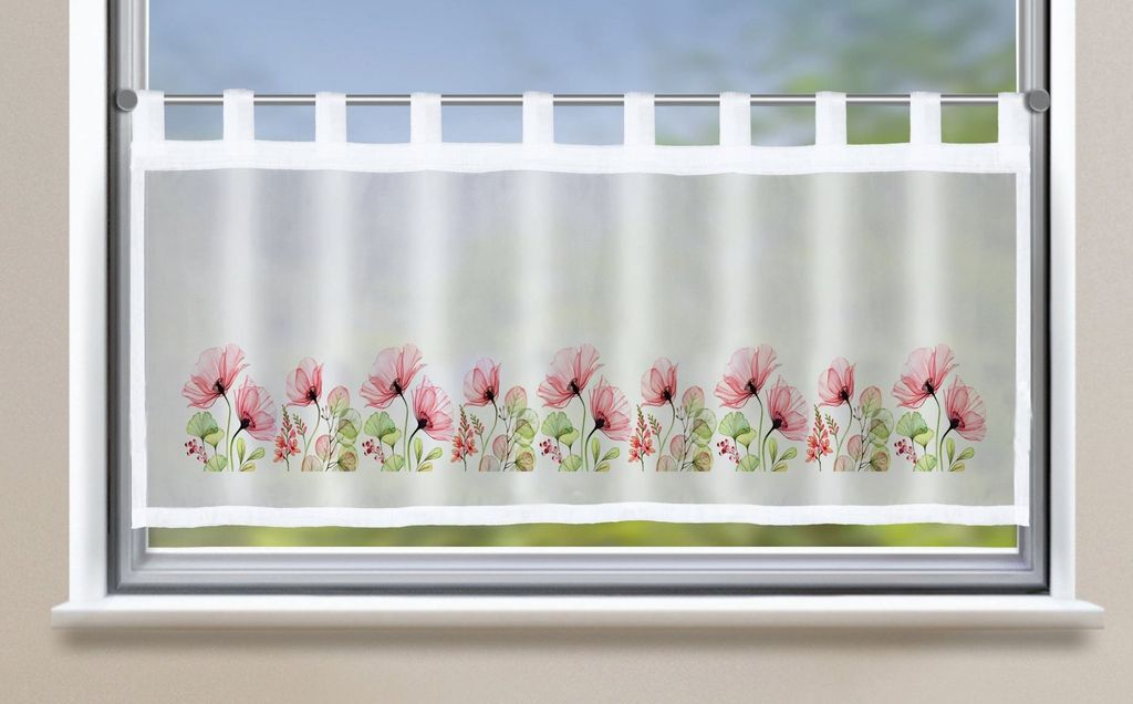 A sheer curtain with a floral pattern is hung on a window.