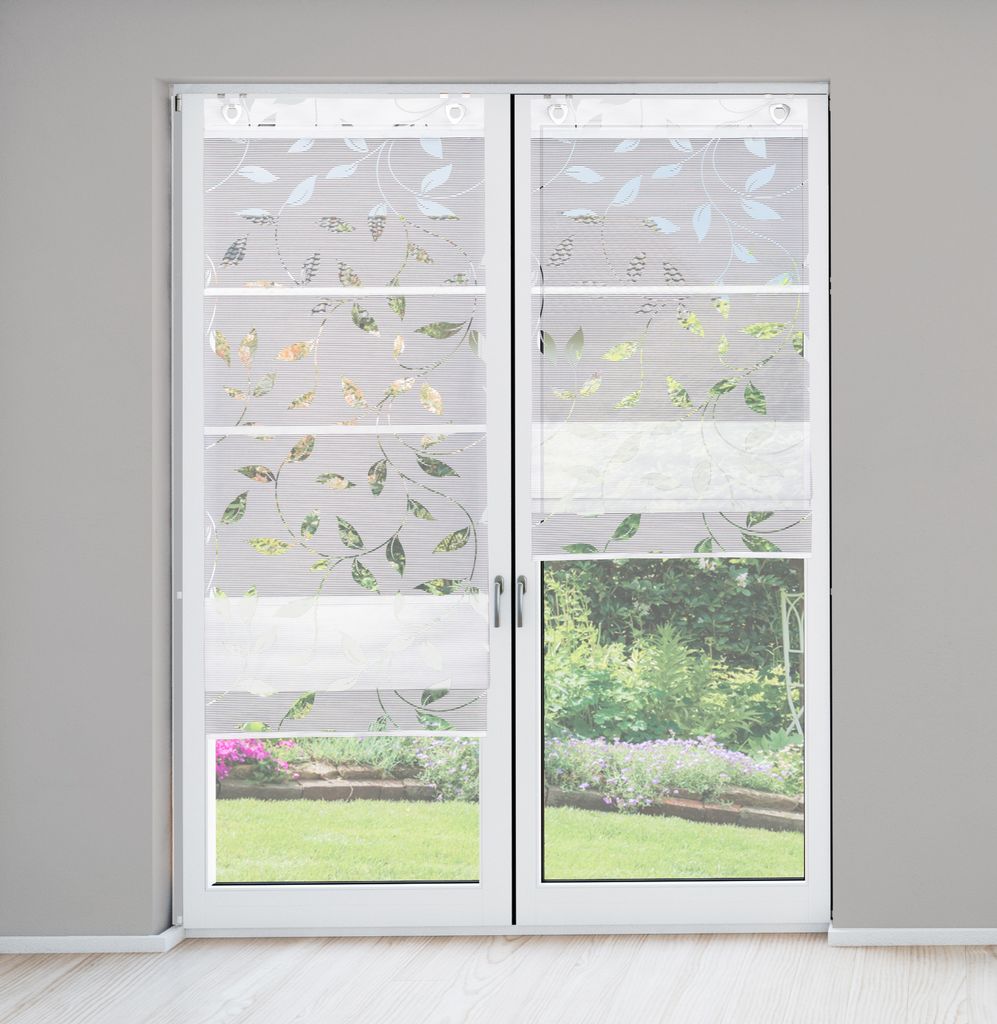A pair of white sliding glass doors with decorative blinds featuring a leaf pattern.