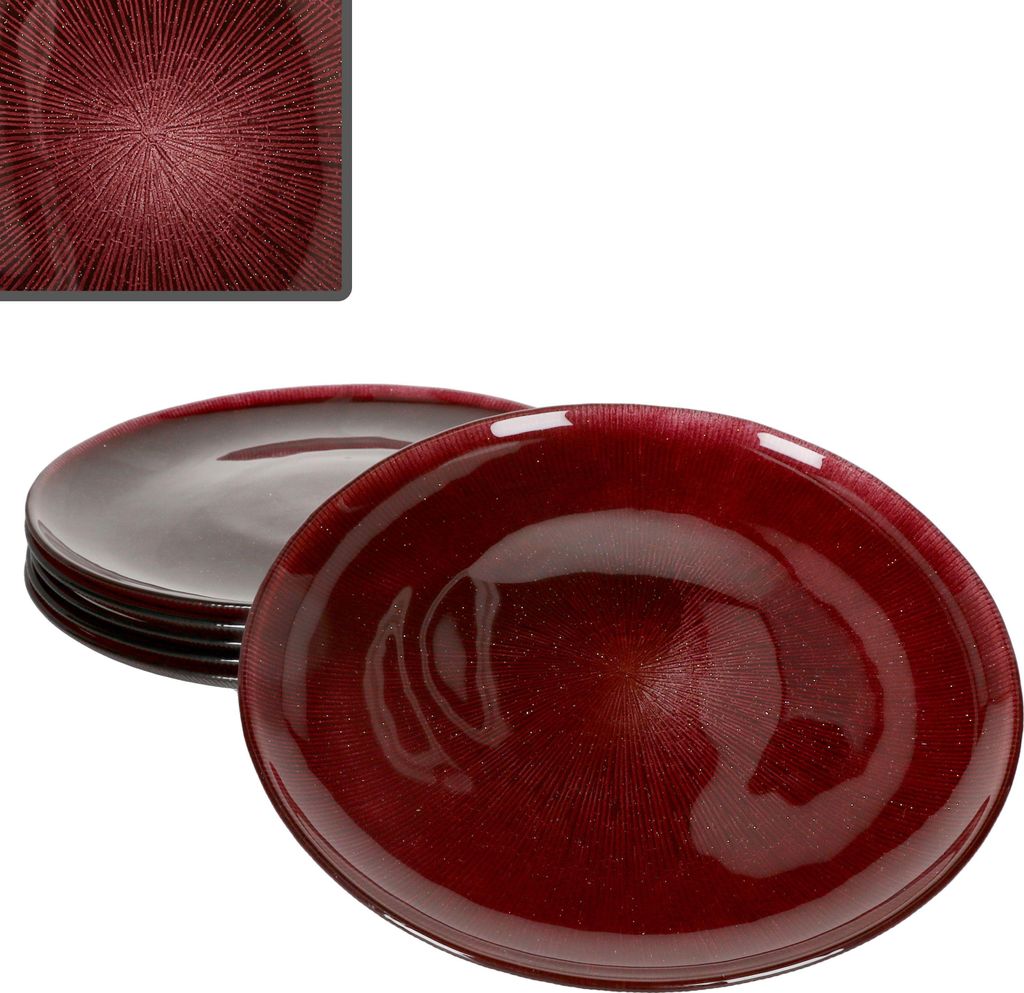 A stack of red glass plates with a textured pattern, with one plate in the foreground.