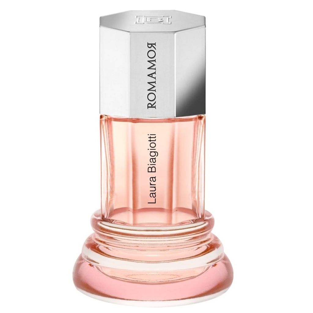 A perfume bottle with a pink liquid and a silver cap.
