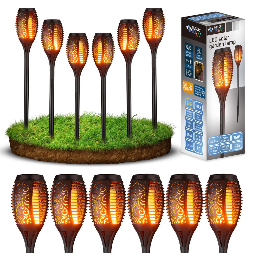 A set of solar garden lamps with a flame effect, displayed on a patch of grass, next to their packaging.