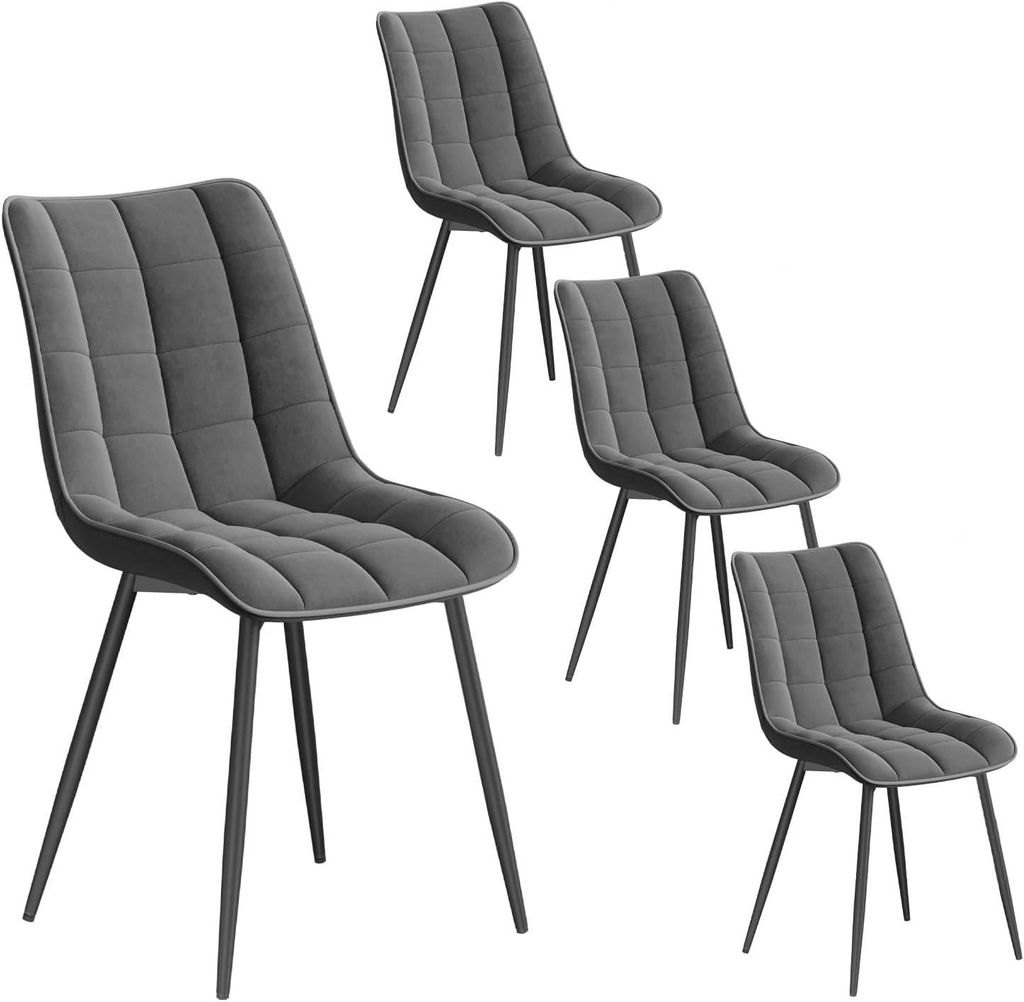 Four dark gray upholstered dining chairs with black metal legs are arranged on a white background.