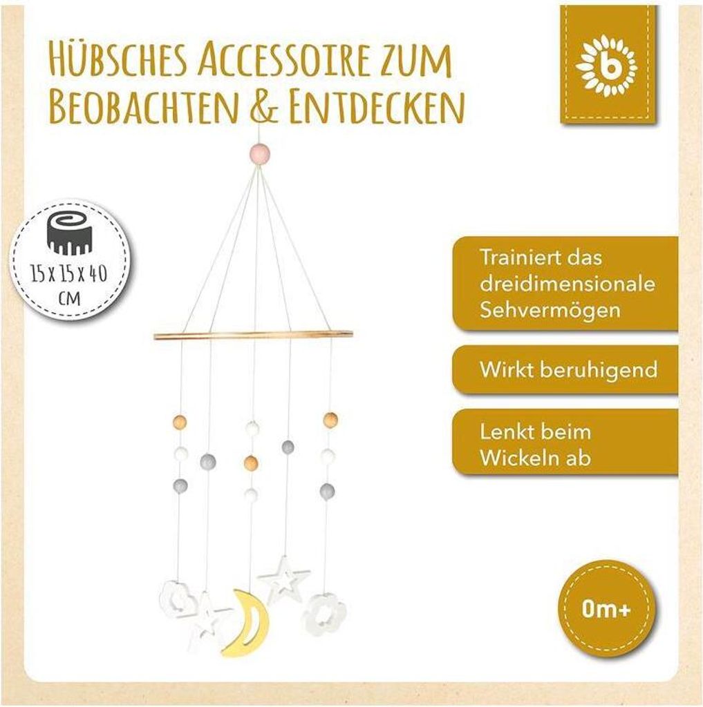 A baby mobile hanging from a wooden bar, with decorative elements like moons, stars, and clouds.