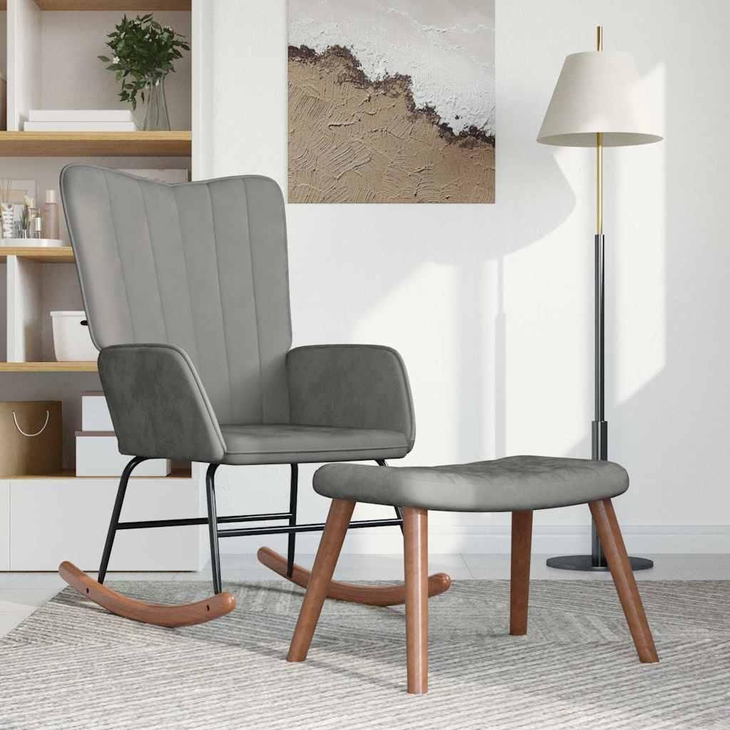 A gray velvet rocking chair and ottoman are placed on a rug in a room with shelves and a floor lamp.