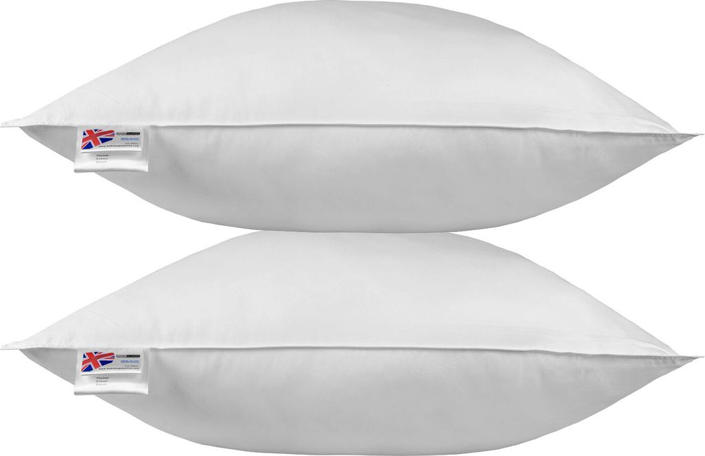 Two white pillows stacked on top of each other.