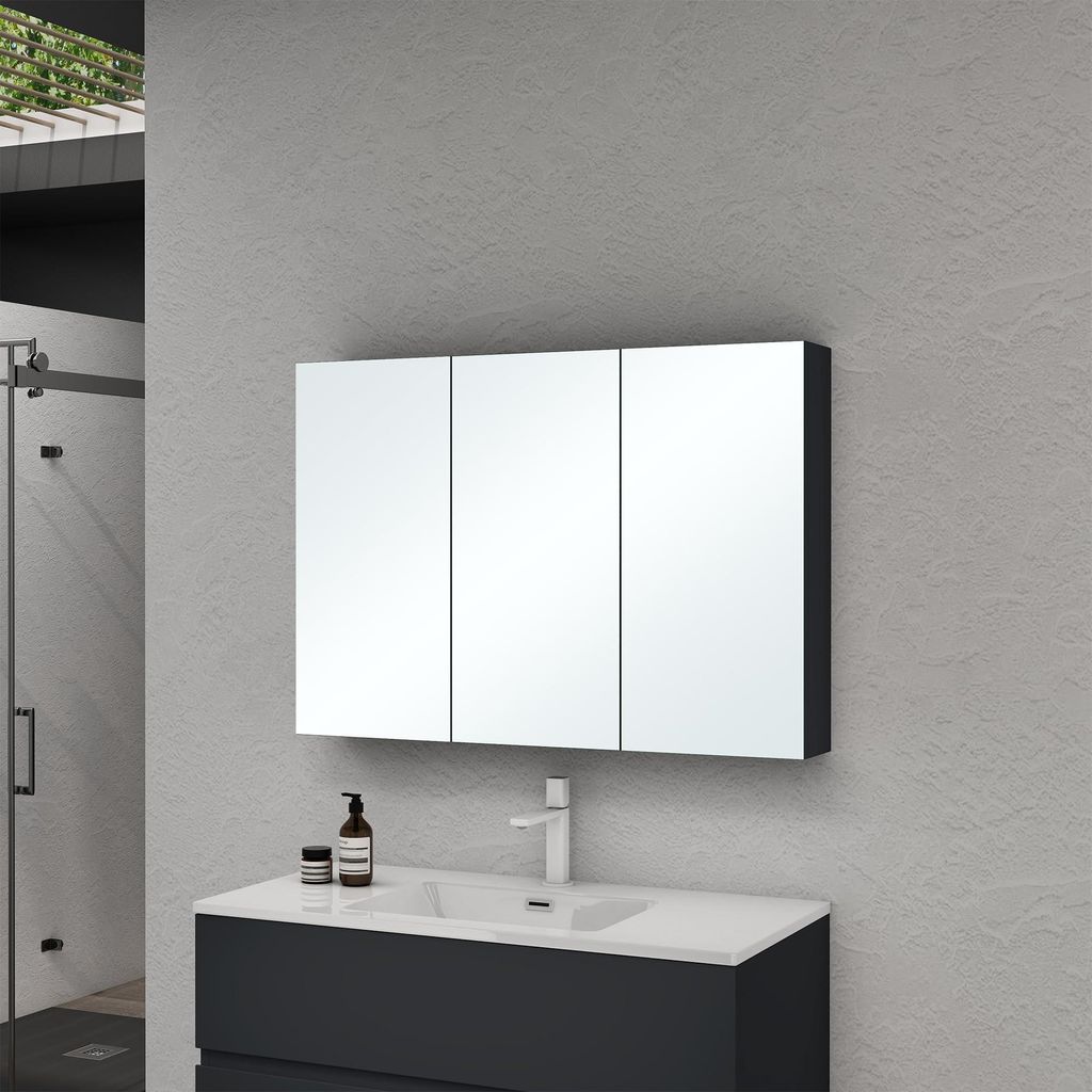 A modern bathroom vanity with a medicine cabinet above.