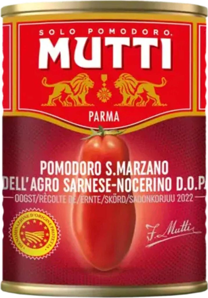 A close-up of a Mutti tomato can with prominent branding and product information.