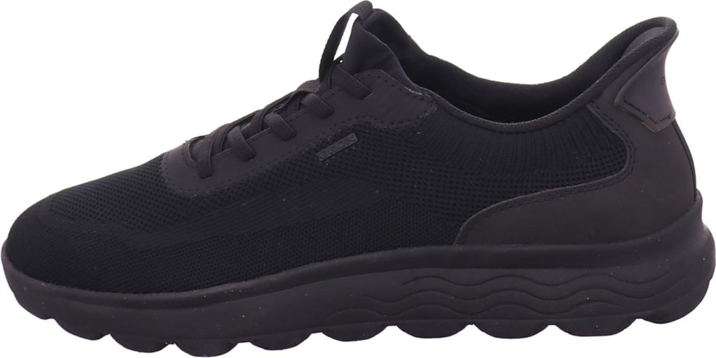 A side view of a black Geox sneaker.