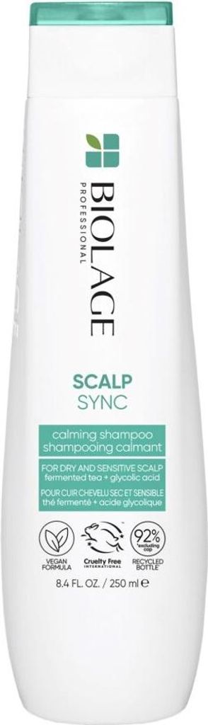 A white bottle of Biolage Professional Scalp Sync Calming Shampoo against a white background.