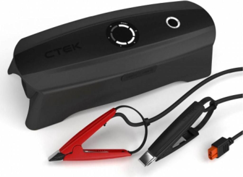 A black CTEK CS FREE battery charger with red and black clamps and an orange connector.