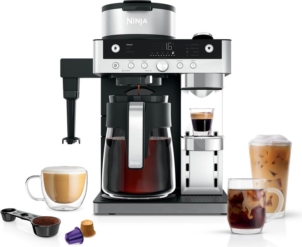A coffee machine with various coffee drinks and accessories displayed around it.