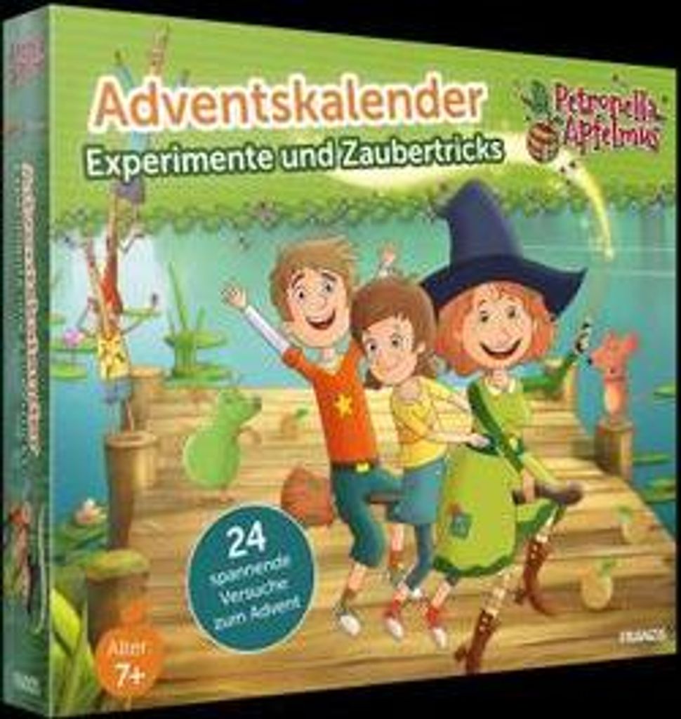 The image shows the front of a product box for an advent calendar with illustrations of children and a witch. The background depicts a lake or pond scene with a wooden dock.