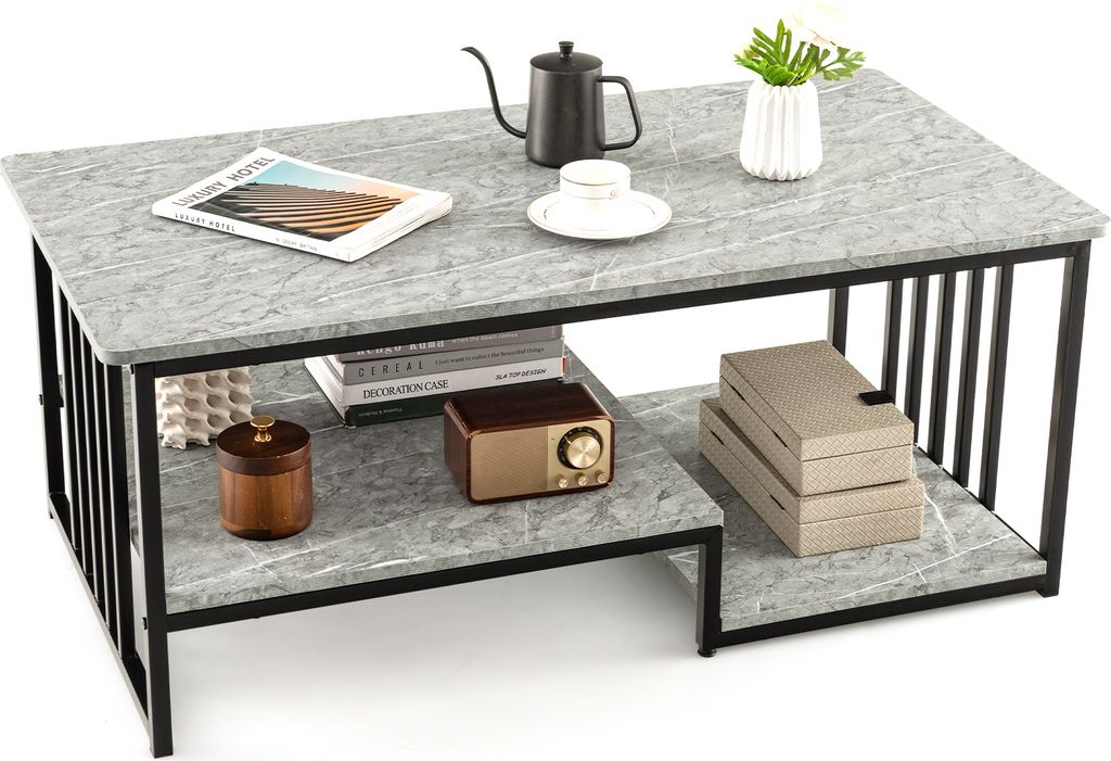 A modern coffee table with a marble-like top and black metal frame, featuring two shelves and decorative items.