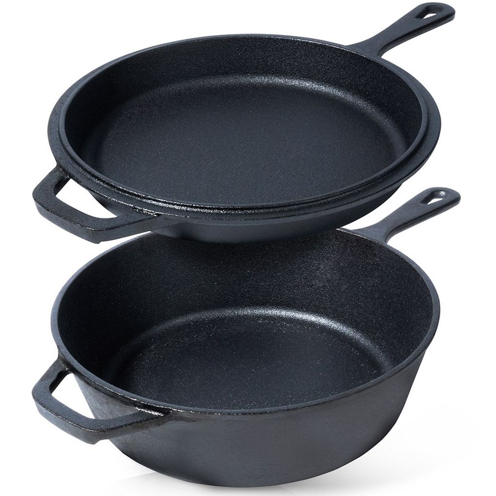 Two black cast iron cooking pans are stacked on a white background.