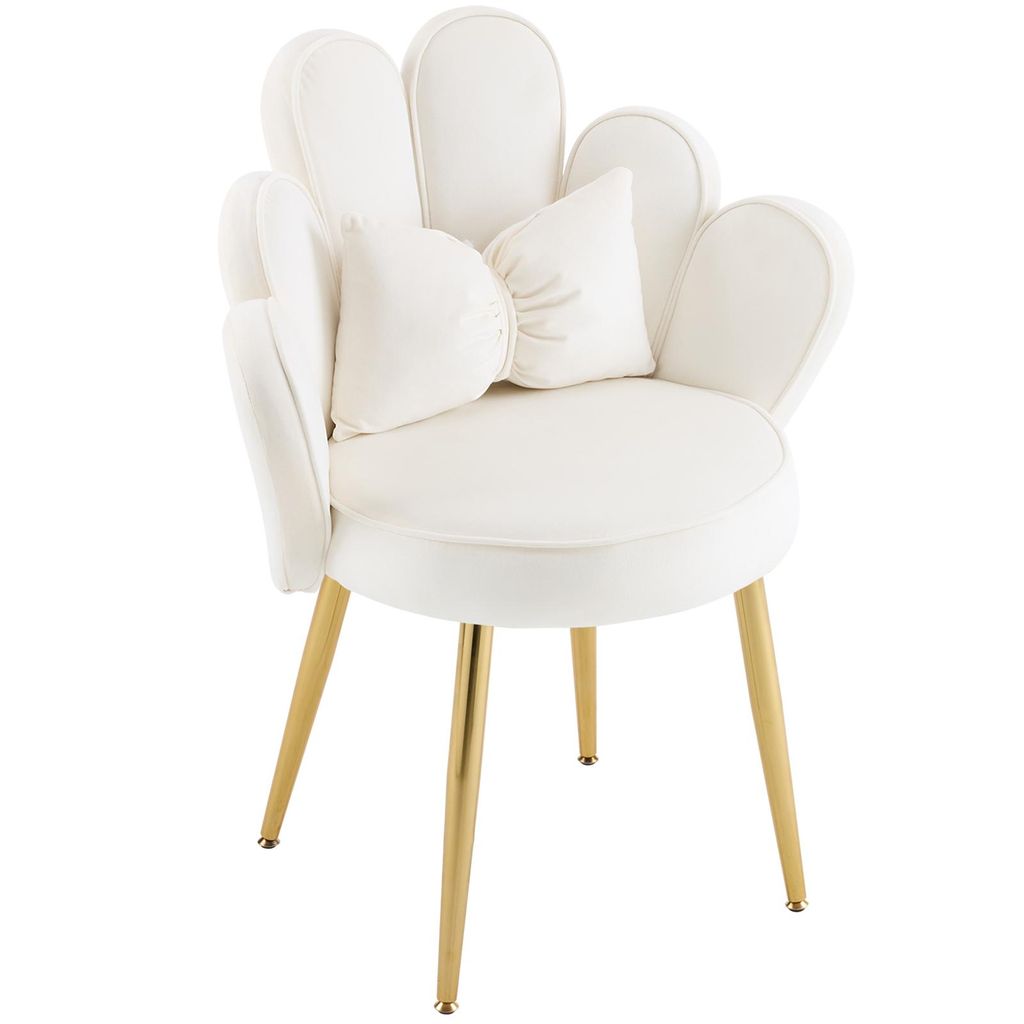 A white velvet chair with gold legs and a decorative pillow.