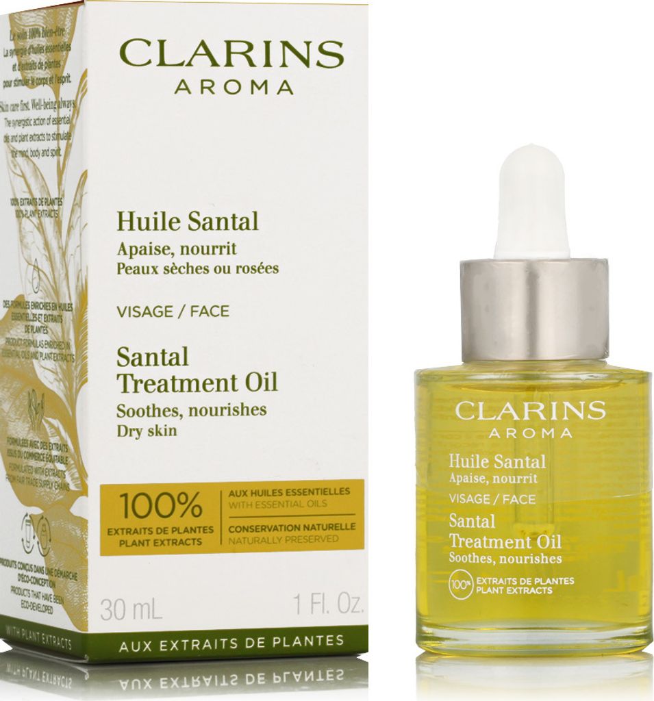 A product box and bottle of Clarins Aroma Santal Treatment Oil.