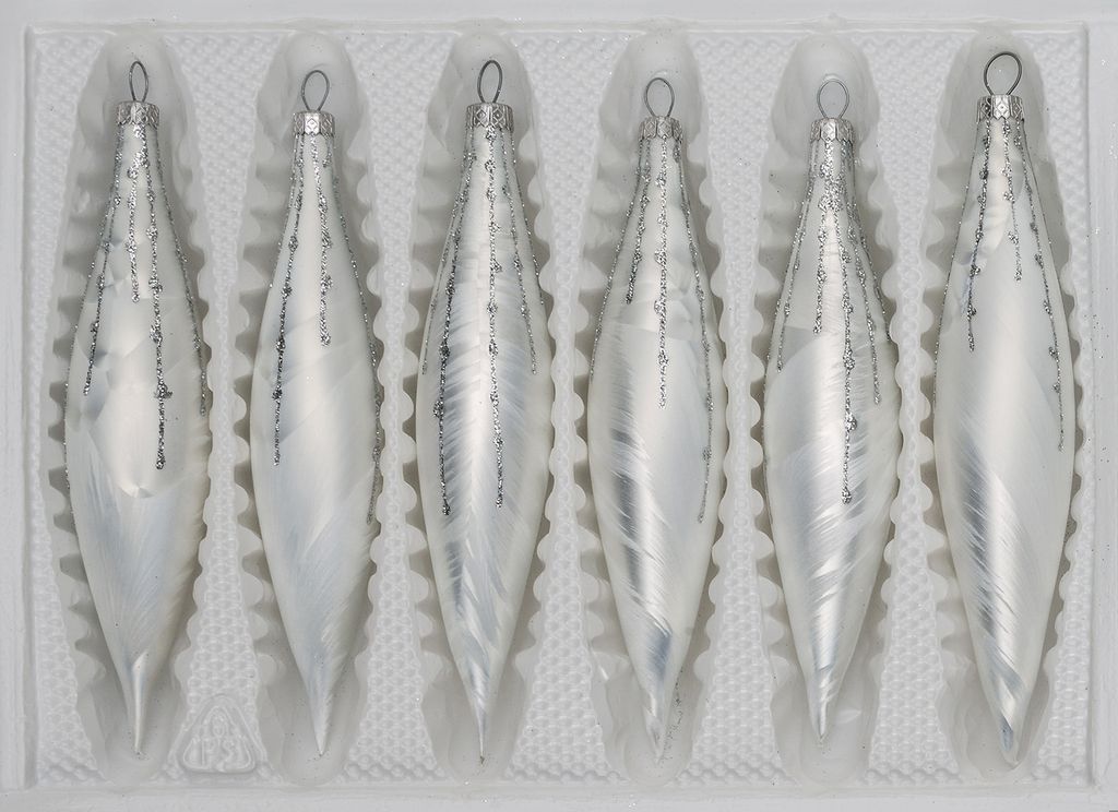 A set of six glass icicle ornaments in a white molded plastic tray.