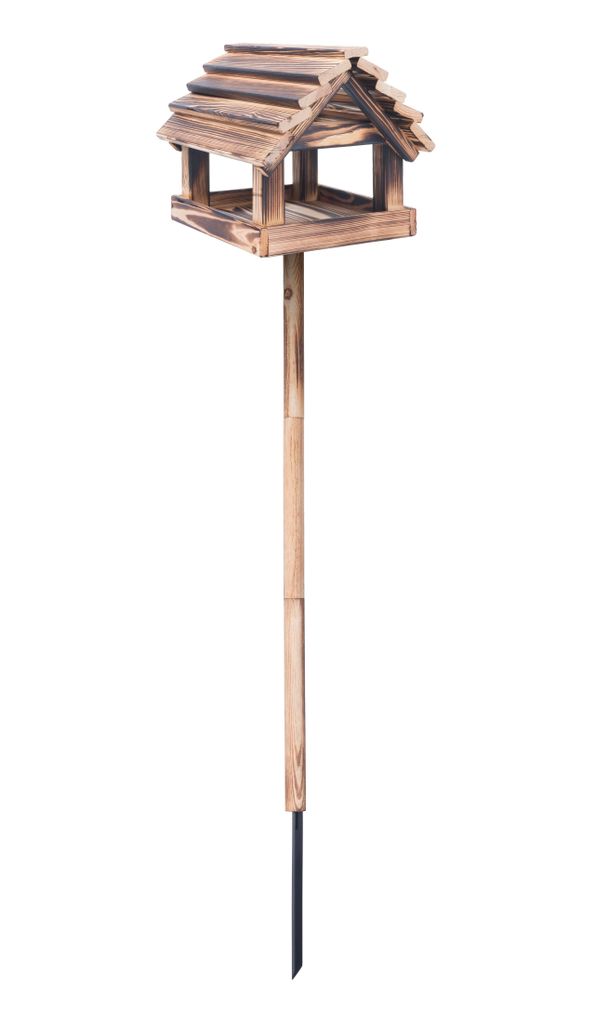A wooden bird feeder on a pole against a white background.