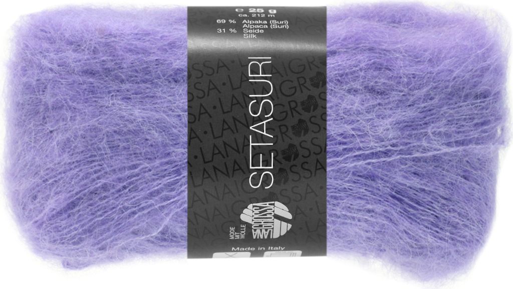 A ball of purple yarn with a black label.