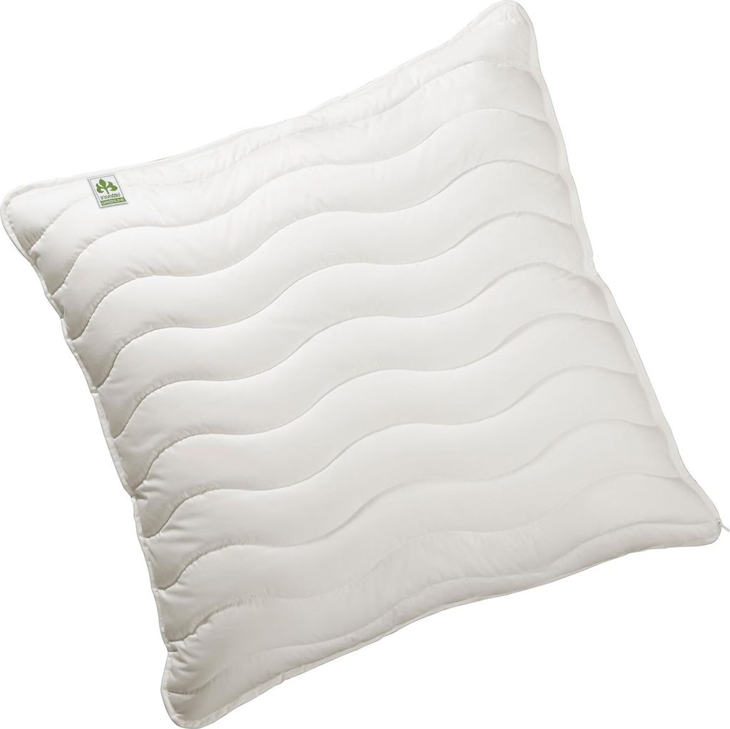 A white pillow with a wavy quilted pattern, shown at an angle against a white background.