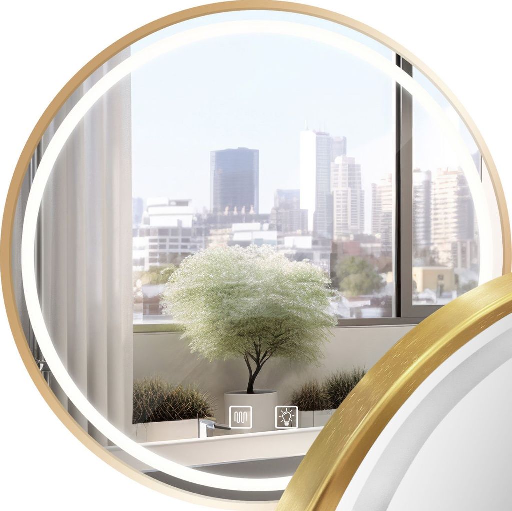 A round mirror with a gold frame reflecting a city view from a balcony.