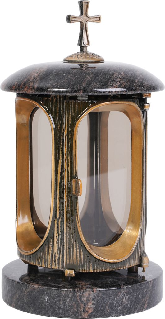 A gravestone lantern with a cross on top, made of dark stone and gold-colored metal.