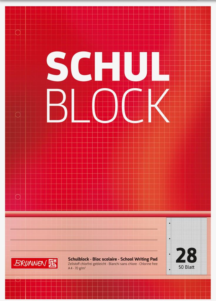 A close-up of a red and white school writing pad with grid lines and text.