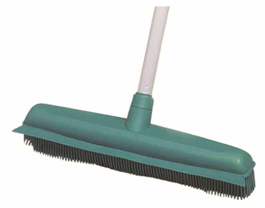 A close-up studio shot of a green rubber broom with a white handle against a white background.
