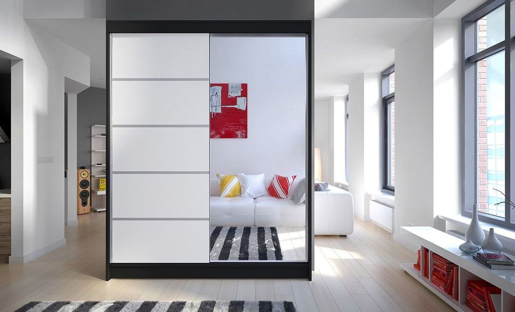 A modern hallway with a large wardrobe with mirrored doors reflecting a living room.